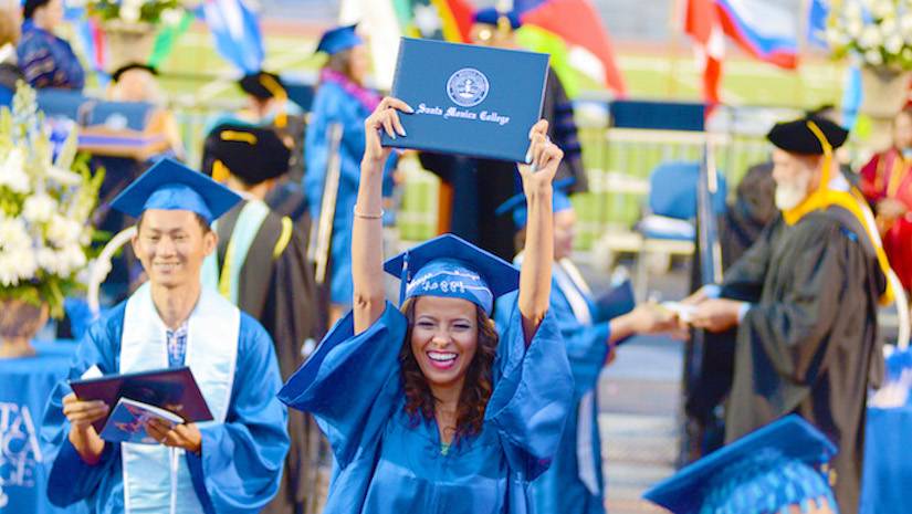 SMC graduate with diploma