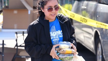 Student picking up Food from SMC