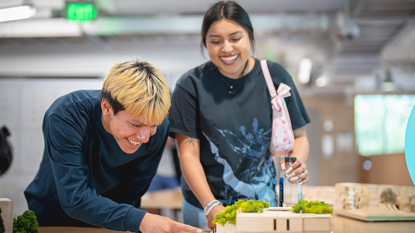 SMC architecture students view a model during an end-of-year design showcase at the Center for Media & Design, where the program is housed.