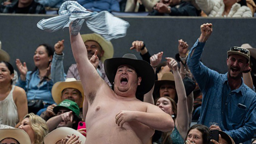 An image from Danilo Perez’s JACC first place winning photo story. A shirtless man dances to country music in the stands of Crypto.com Arena in Los Angeles, Calif. on Saturday, Feb. 16, 2023. (Photo Credit: Danilo Perez | The Corsair)