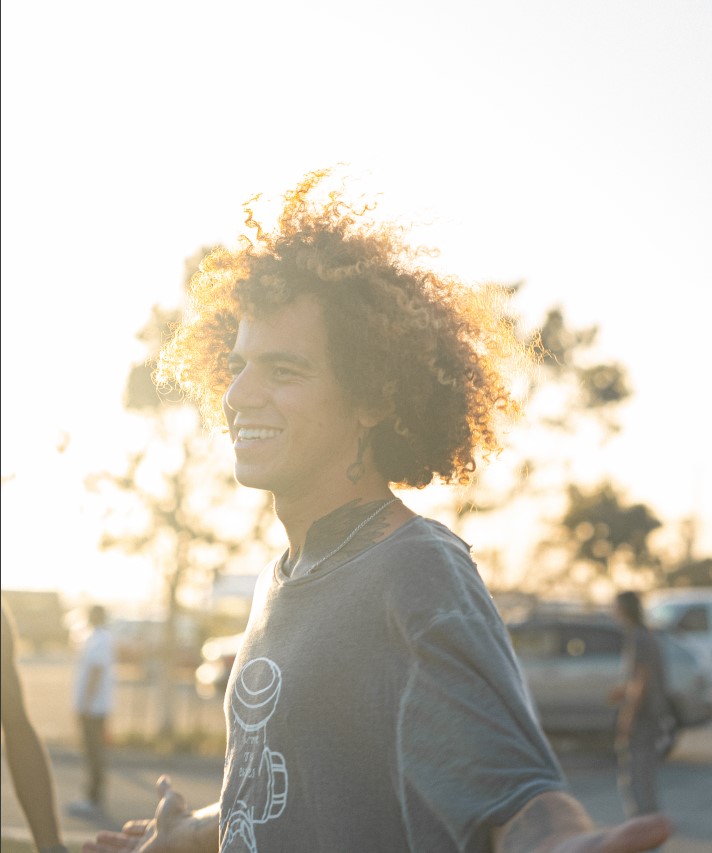 Peer Mentor Alex Smiling in the sunlight